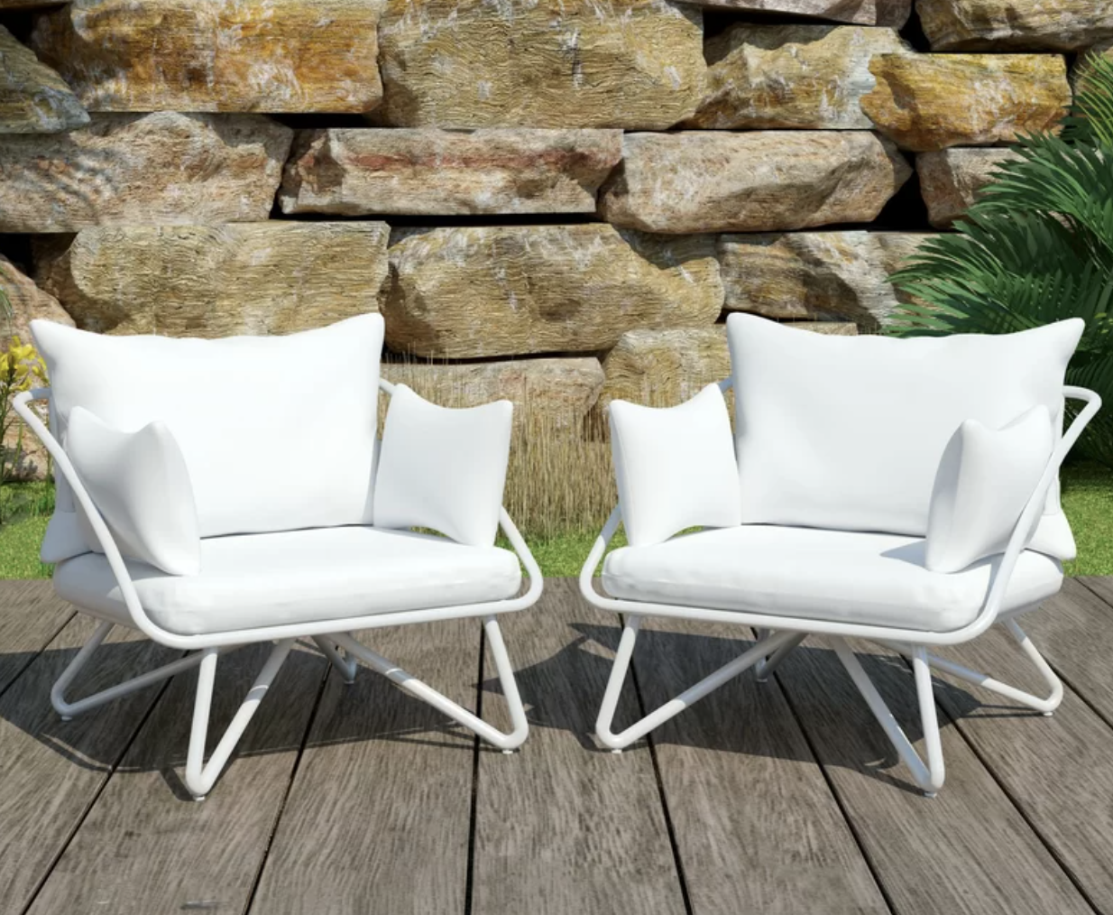 A pair of white patio chairs next to each other on a wooden porch