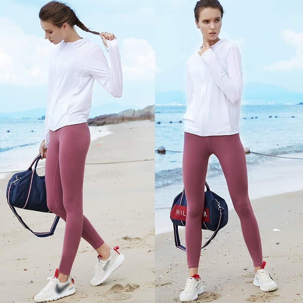 Model wearing the solid, cotton-y leggings in pink 