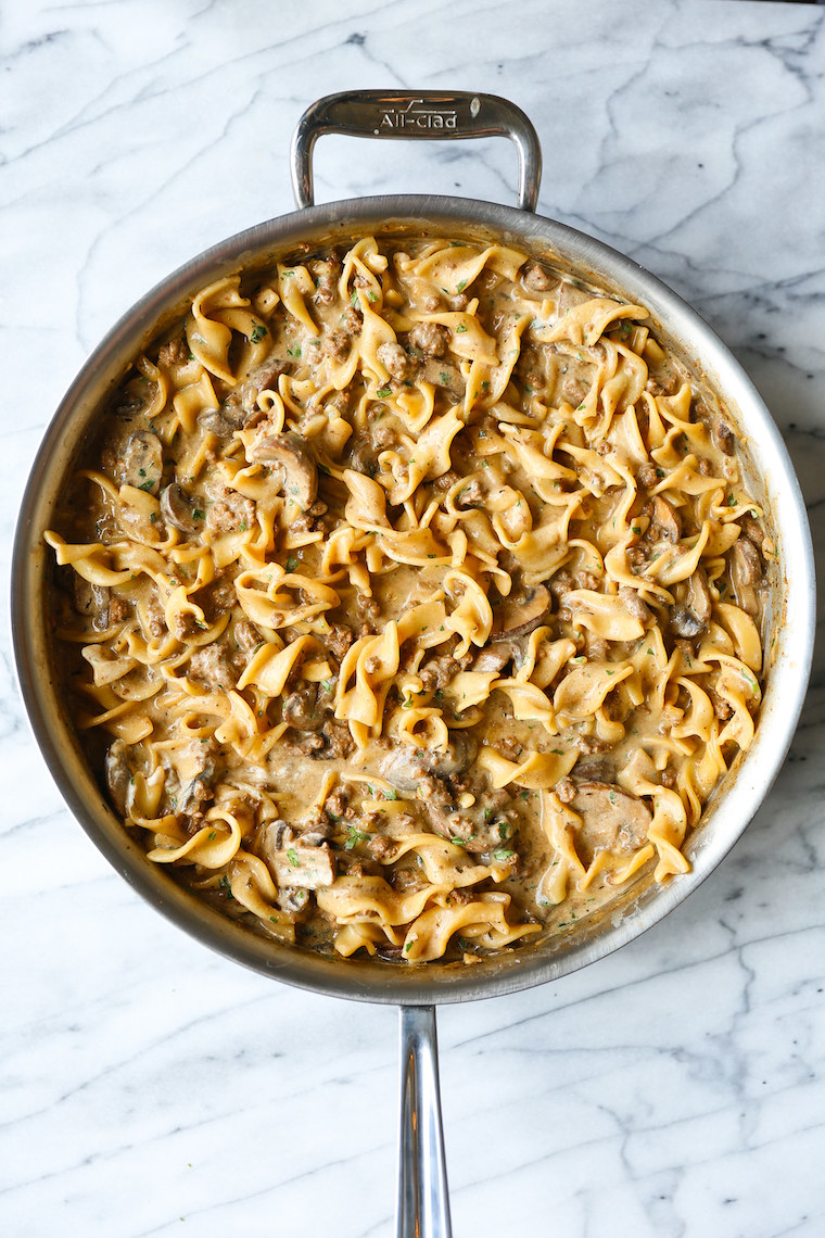 A big skillet full of beef stroganoff and egg noodles in gravy.