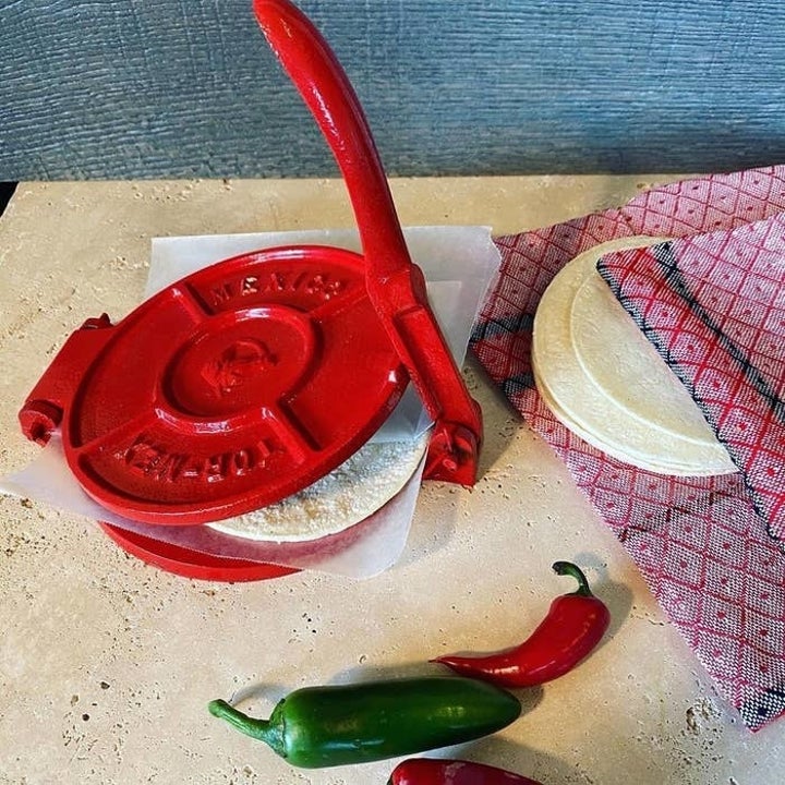 The red tortilla press in action
