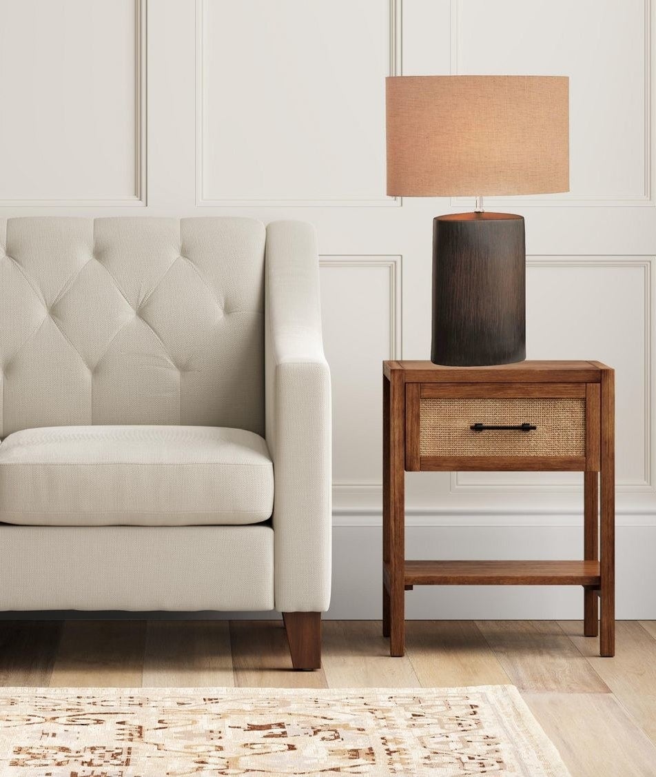 lamp with brown walnut base and light brown shade 