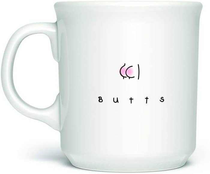 A mug with a cartoon butt on it with the word butts