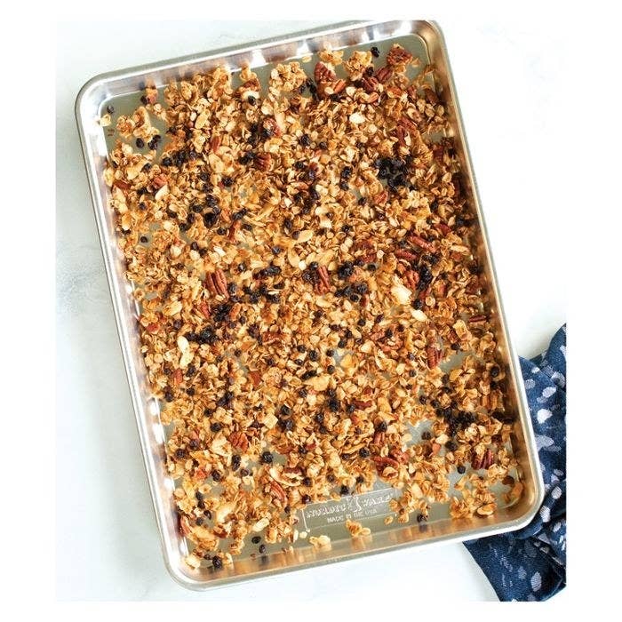 freshly baked granola on a sheet pan