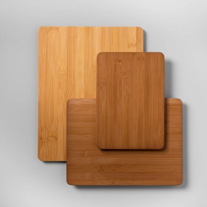 a set of three different sized wooden cutting boards