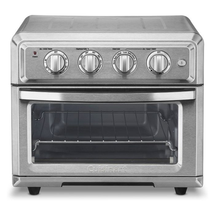 a stainless steel toaster oven with four dials alone the front/top