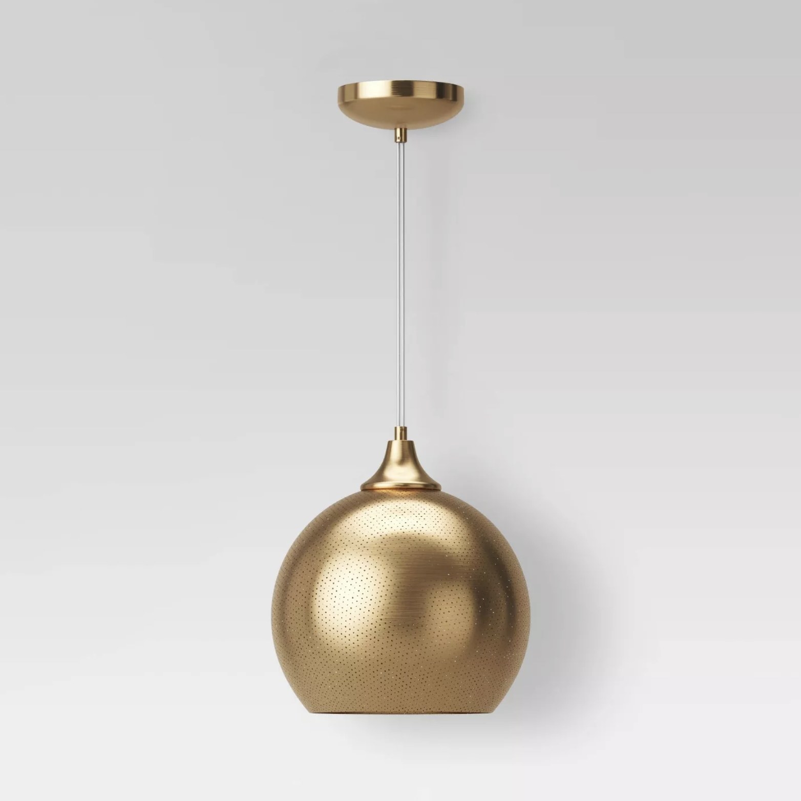 A gold domed light fixture that hangs from the ceiling 