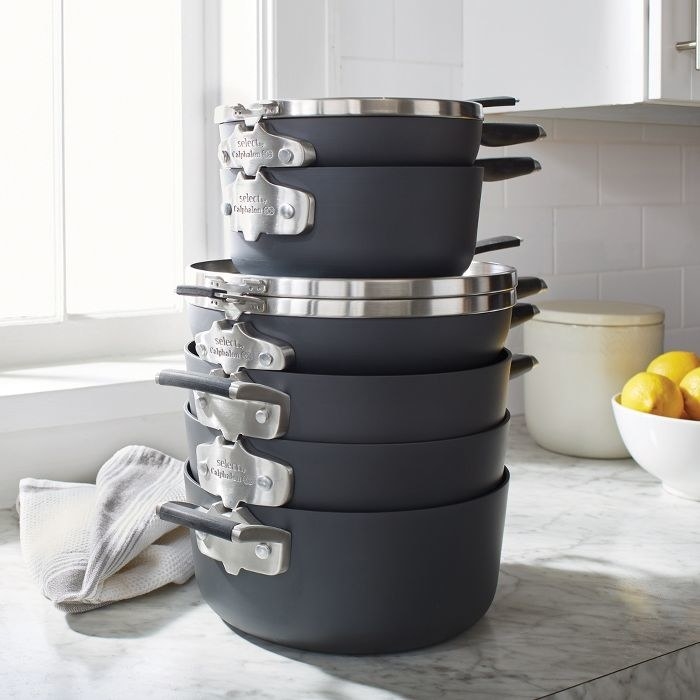 a stack of six pots