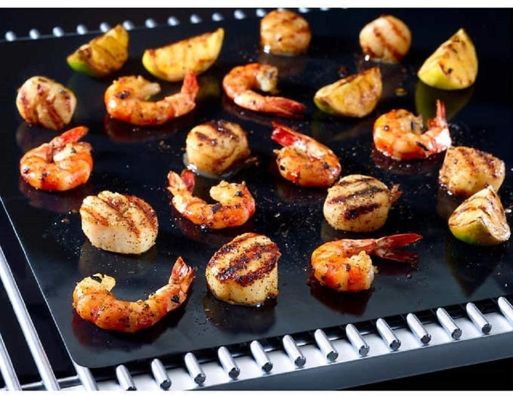 Shrimp and vegetables on a reusable grilling sheet