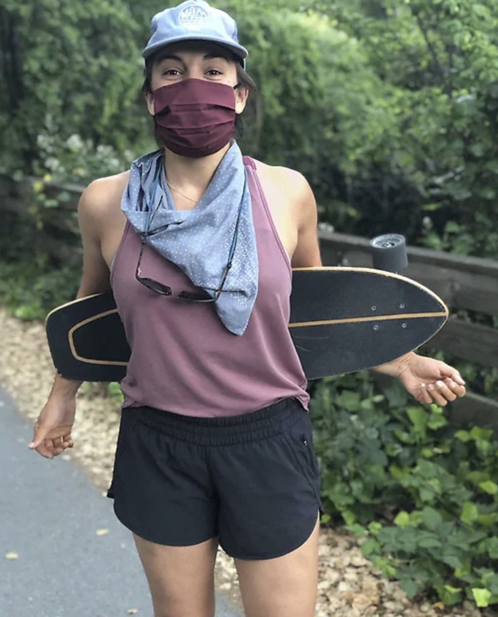 A model in athletic gear and a face mask 