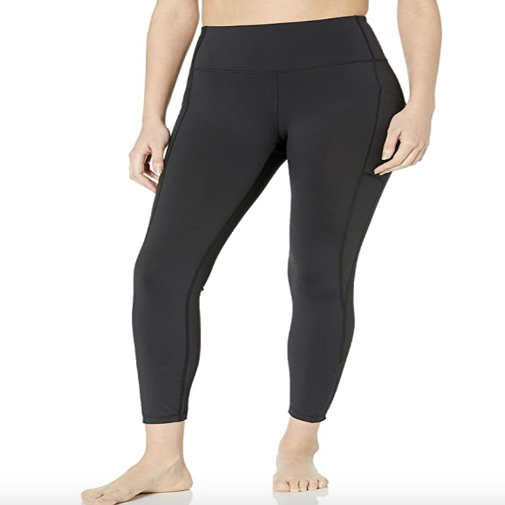 A model in black leggings 