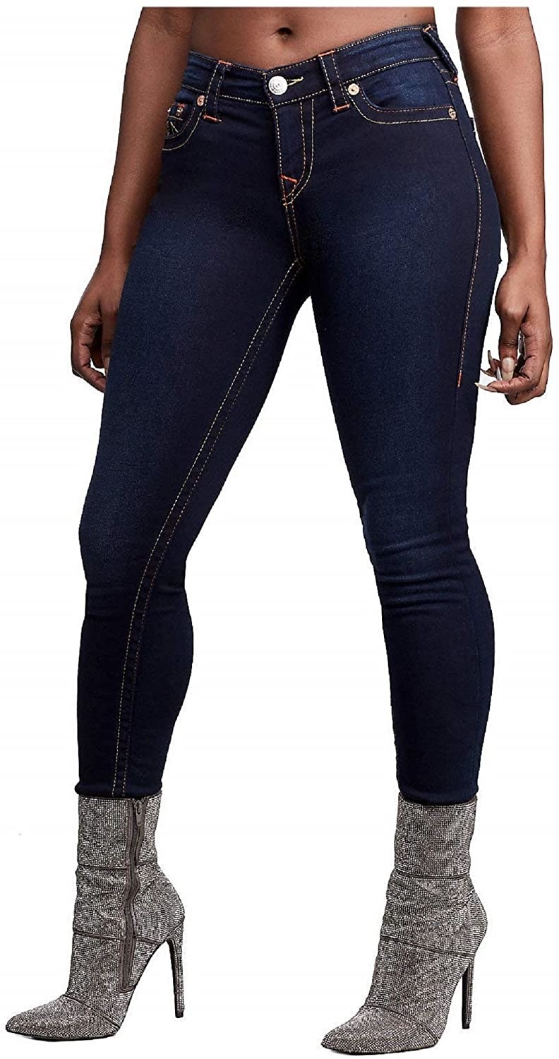 Model wearing the dark blue skinny jeans with gold stitching all around