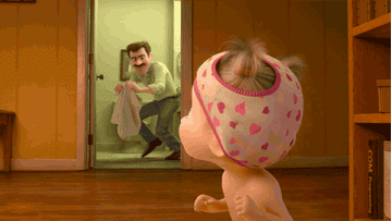 Gif of dad chasing baby with towel.