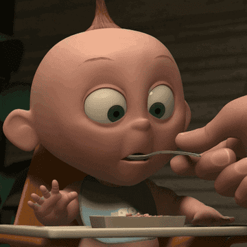 GIf of baby spitting out food.