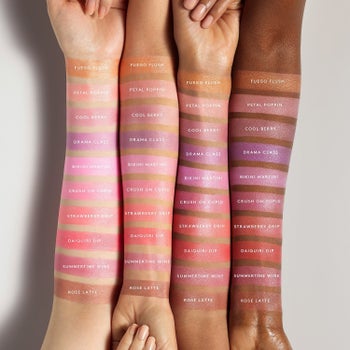 Four models' arms of skin tones from light to dark wearing swatches of all the blush shades