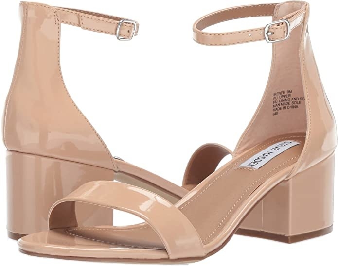 A pair of sandals with a block heel and an ankle closure