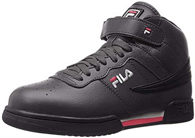 A hightop sneaker with lacing and a velcro strap across the ankle