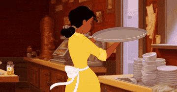 tiana from the princess and the frog saluting while waitressing
