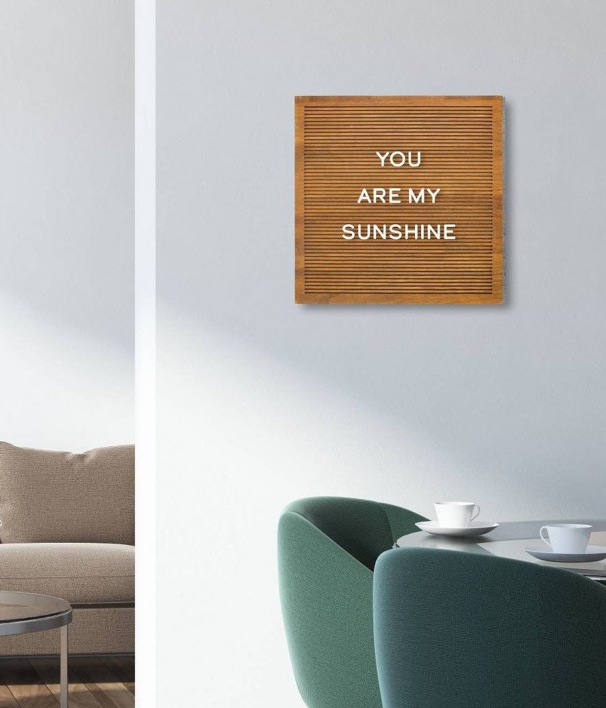 brown board with white letters spelling &quot;you are my sunshine&quot; 