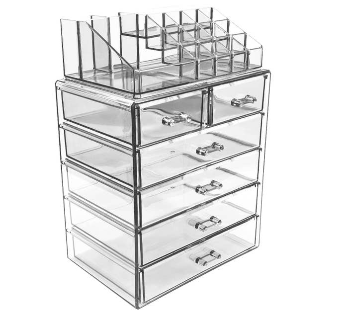The clear acrylic case, which has six shelves and two racks on top