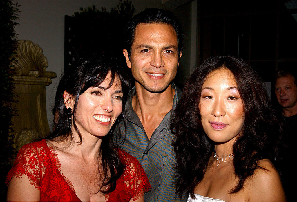 Wells (left) with Benjamin Bratt and Oh at the premiere of Under the Tuscan...