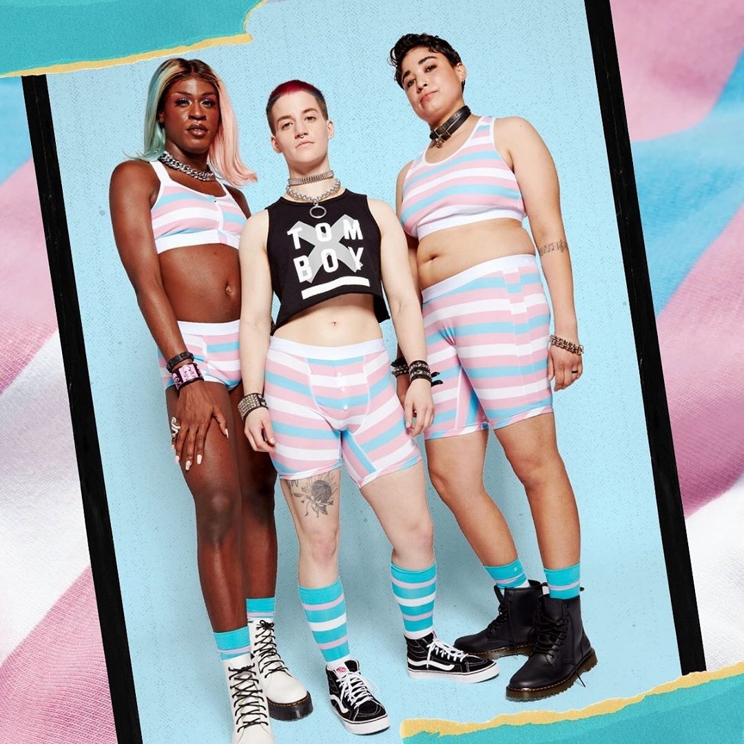 Three models wearing the trans pride flag boxer briefs