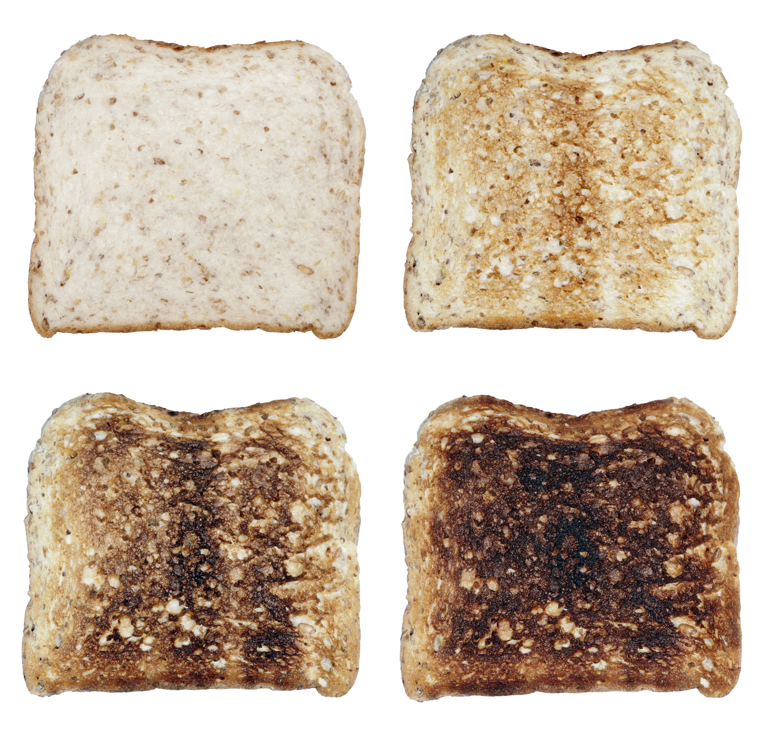 Four slices of toasted white bread in order or least toasted to burnt.