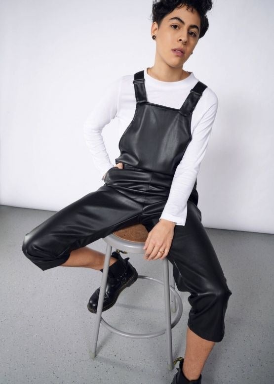 Model wearing the vegan leather overalls 