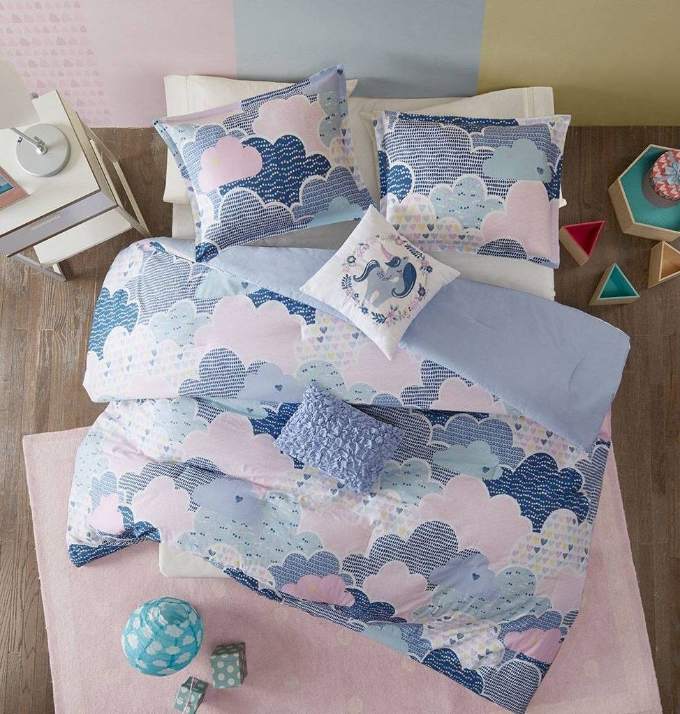 the comforter in blue and pink
