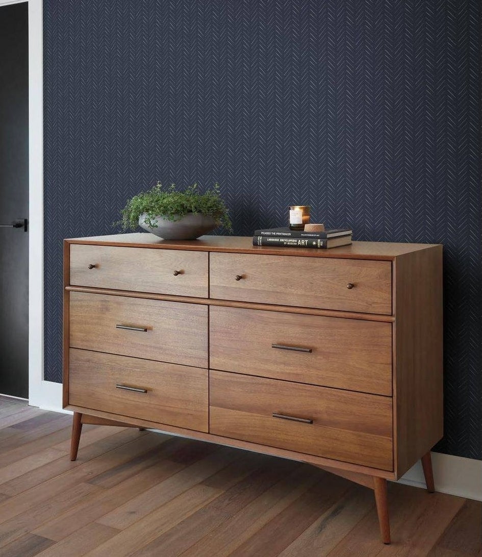 the dark blue herringbone print wallpaper