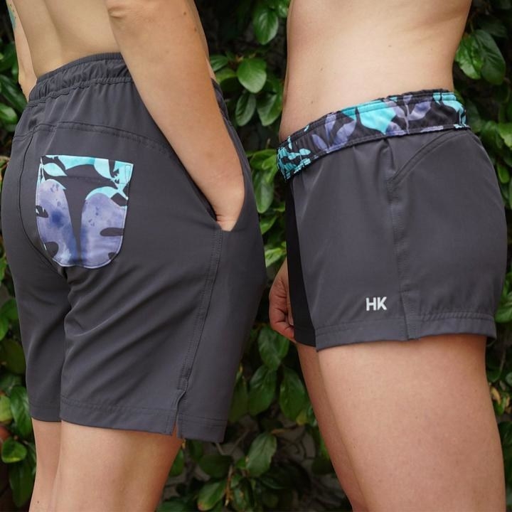 Models wearing the swim trunks in two lengths 