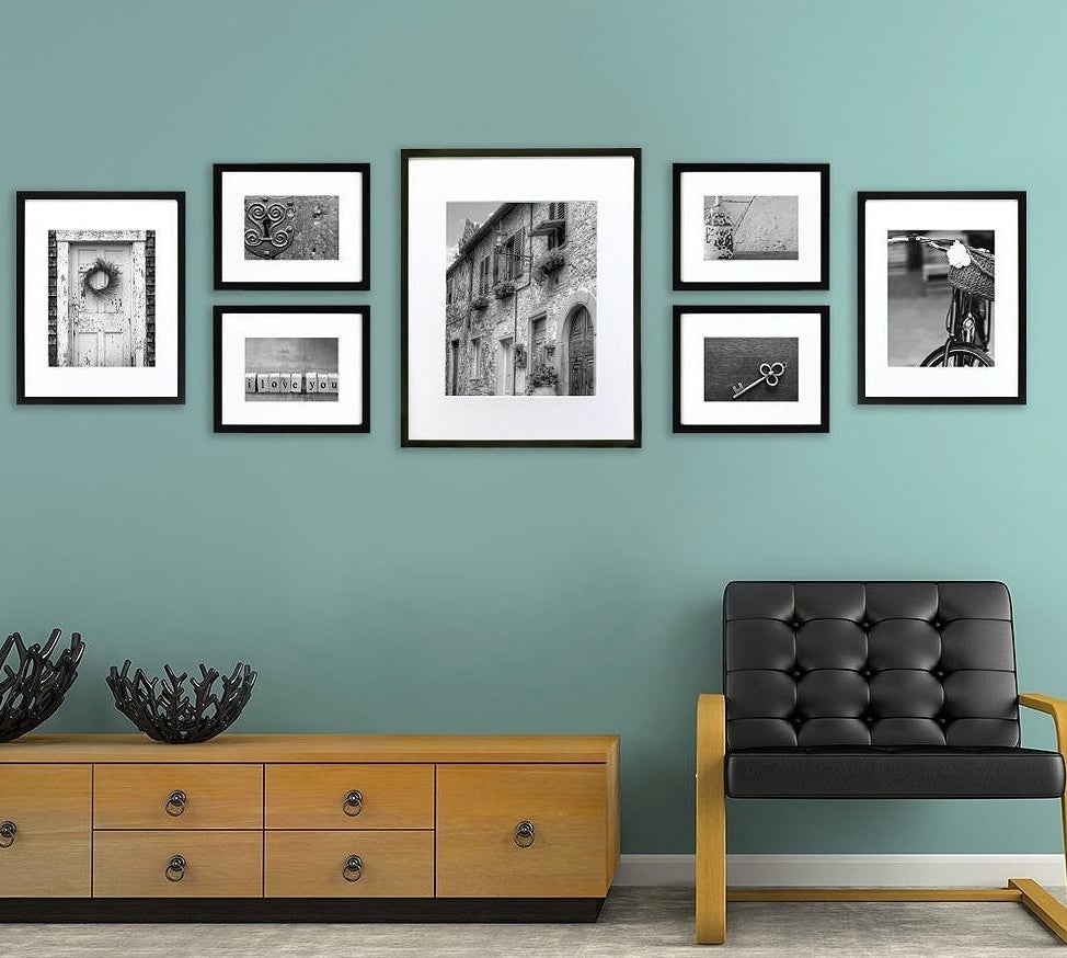 seven picture frames with black frames 