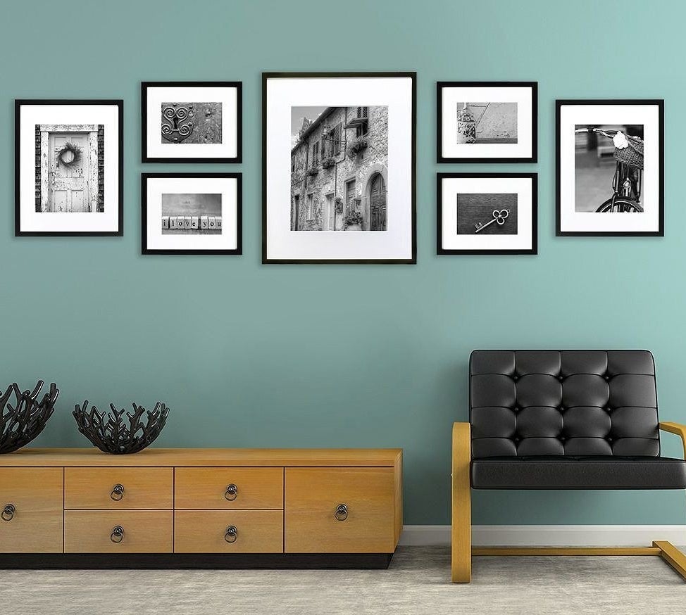 seven picture frames with black frames