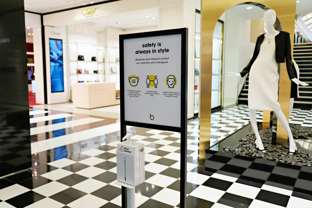 A sign describing safety measures is displayed inside Bloomingdale&#x27;s