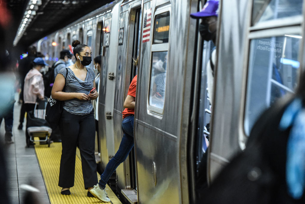 People commute on the subway in Brooklyn