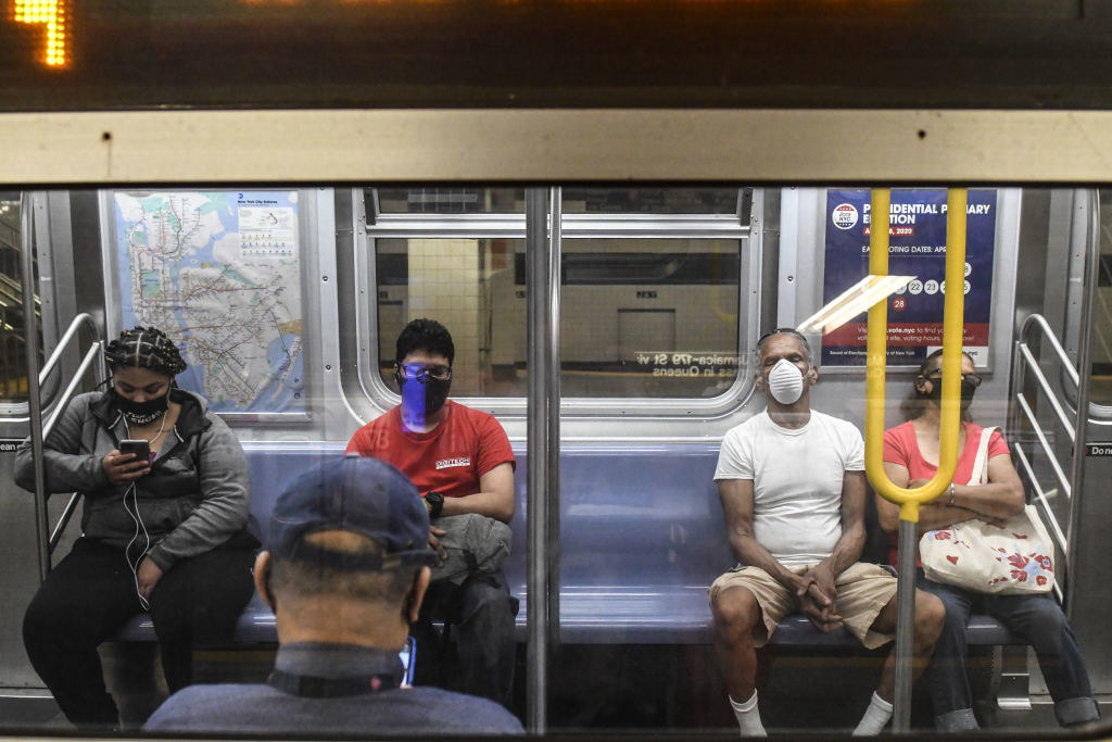 People commute on the subway in Brooklyn