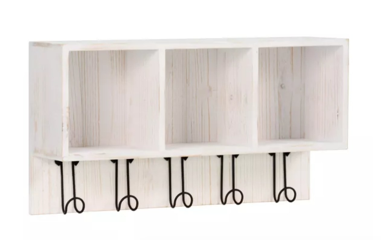 the white wooden  cubby organizer with hooks
