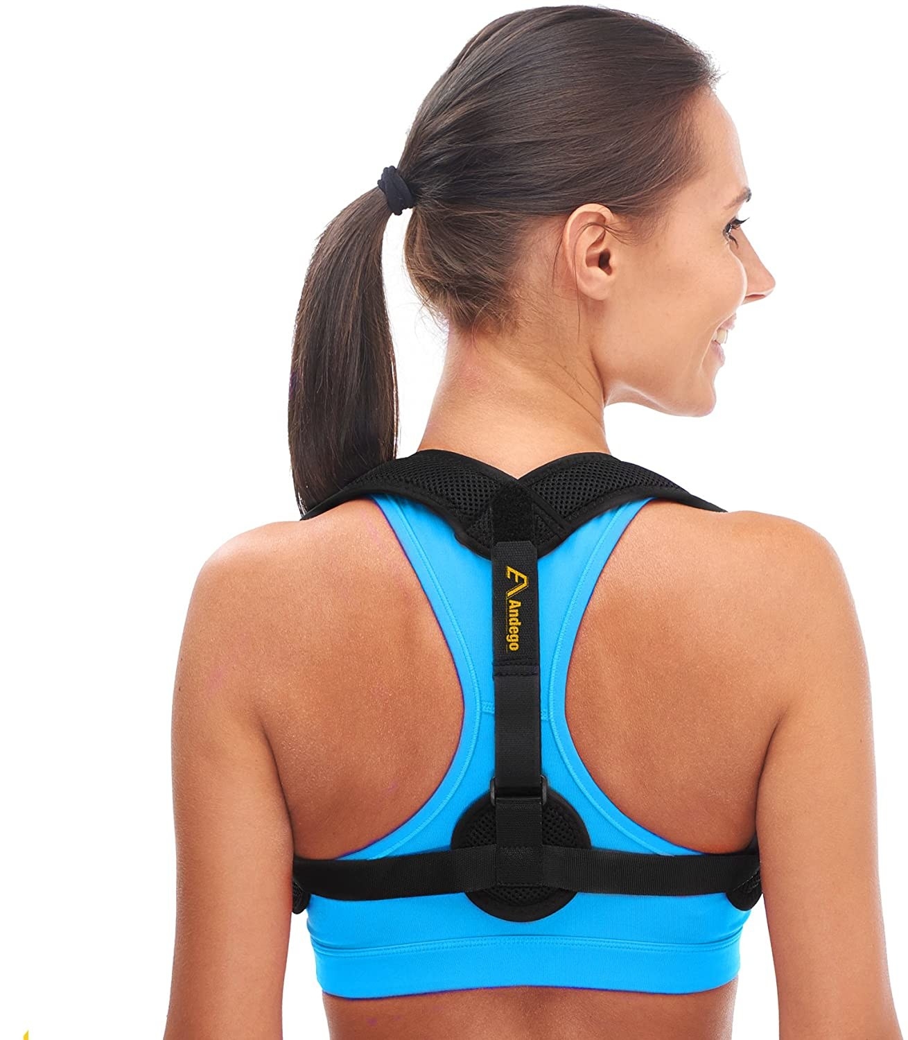 A person is wearing a posture corrector pictured from the back