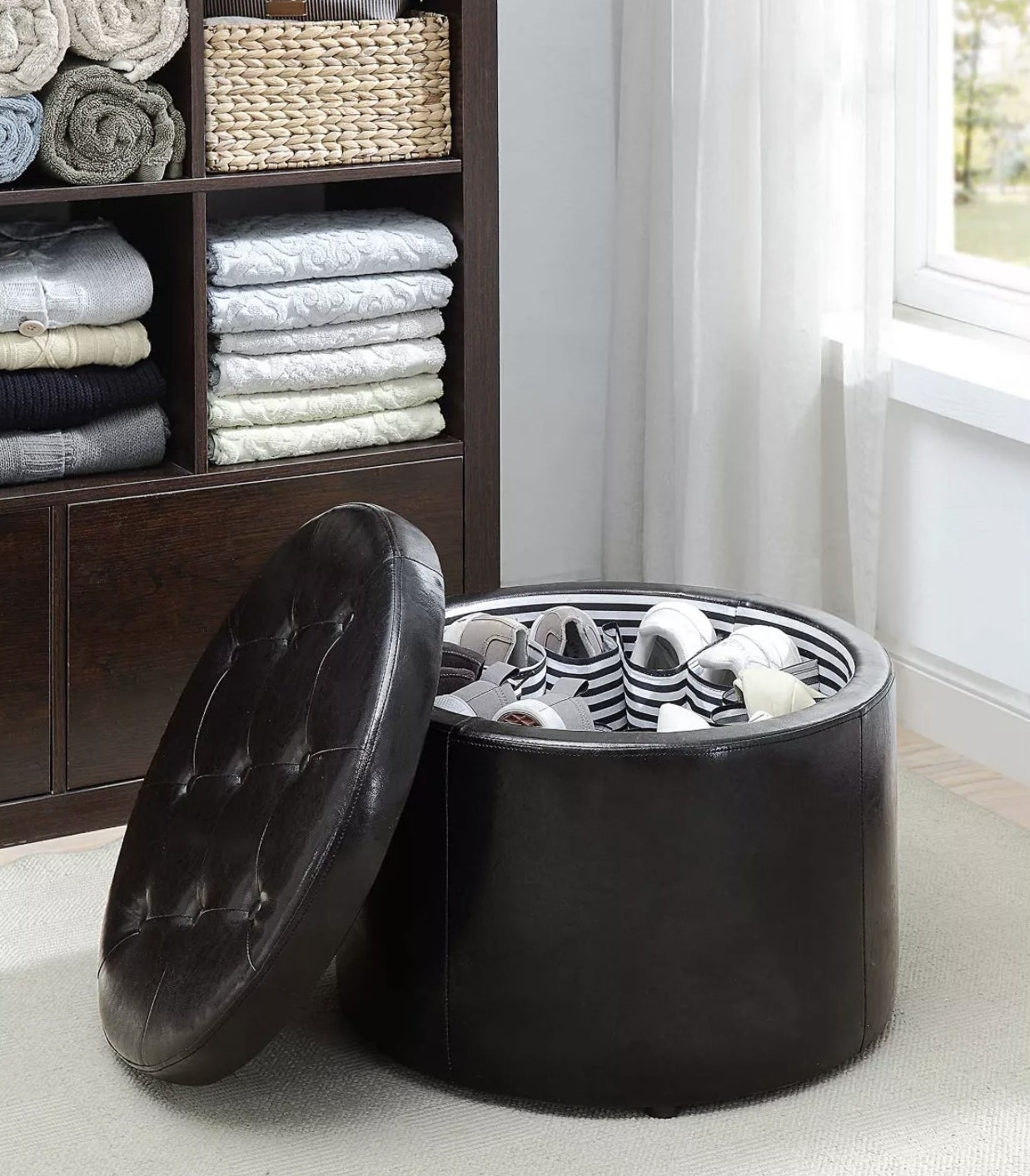 The round leather ottoman