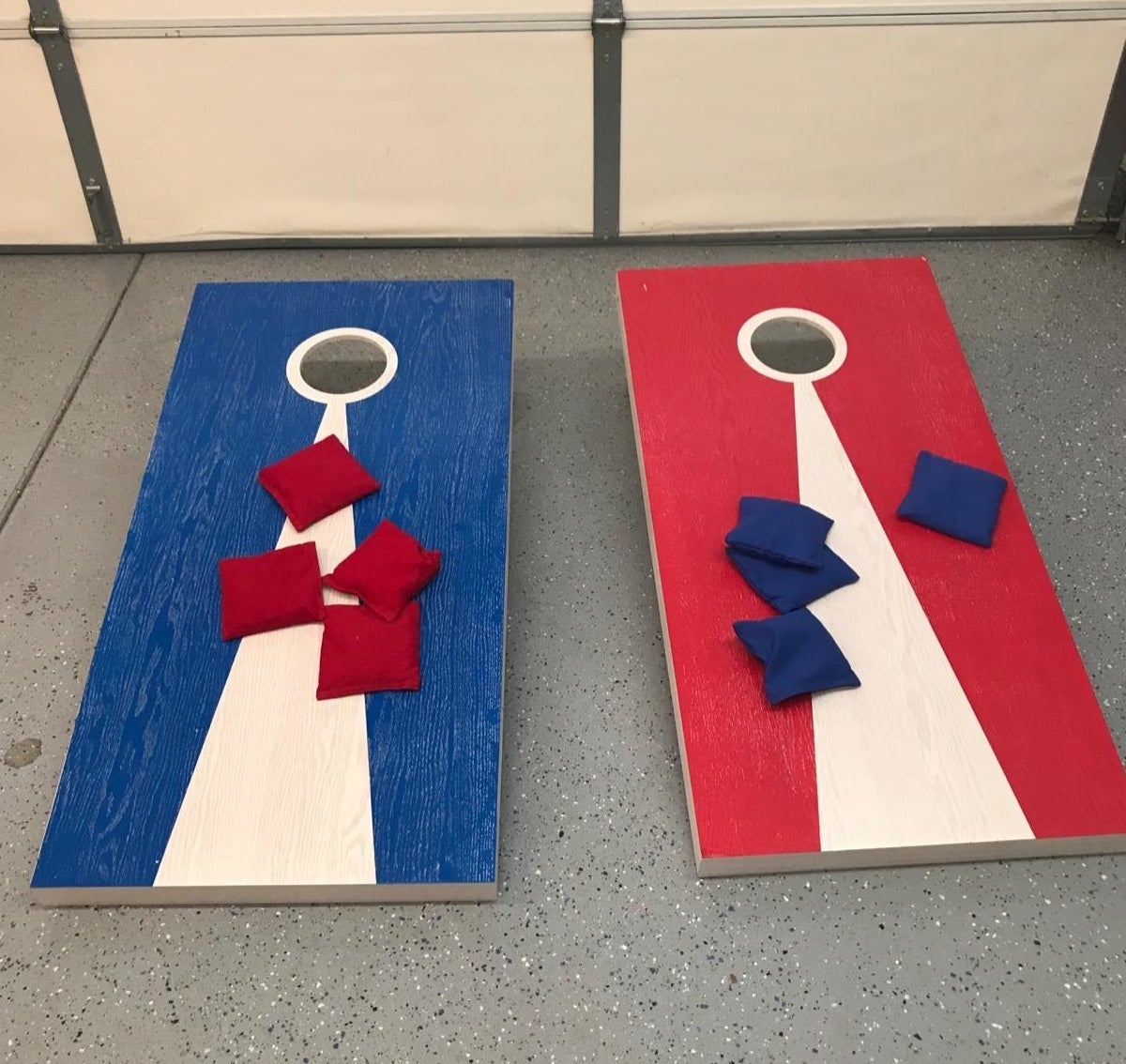 red and blue cornhole boards with red and blue beanbags