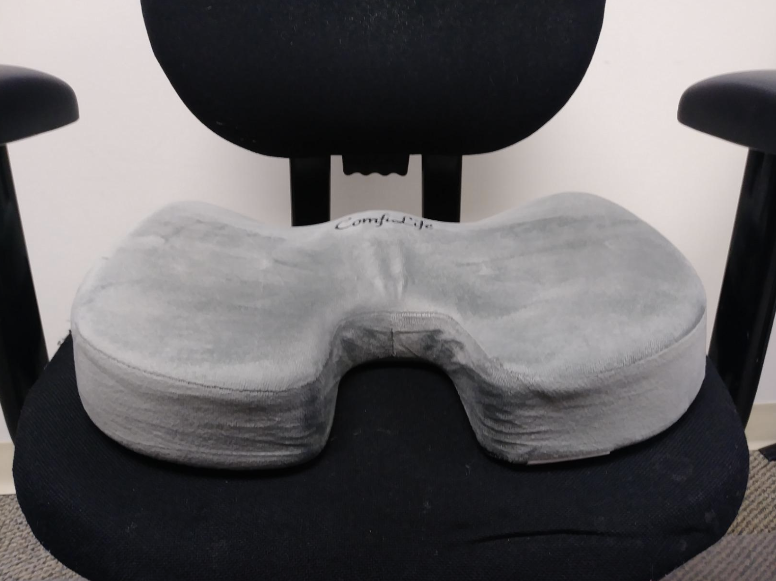 the u-shaped pillow on chair 