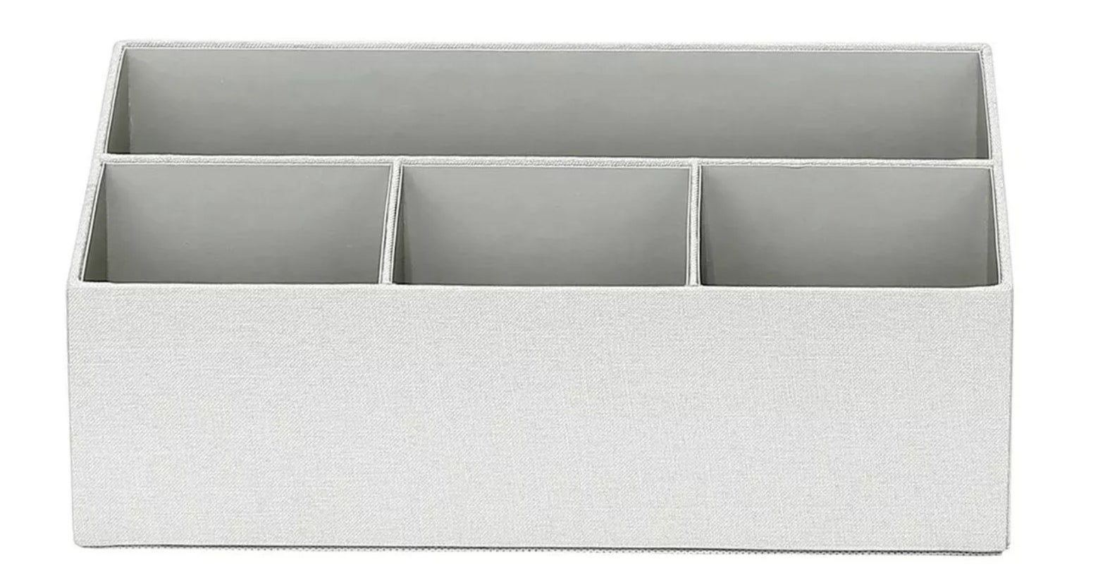 The grey fabric desk organizer with four compartments