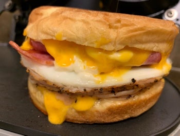 A review image of a cheesy sandwich