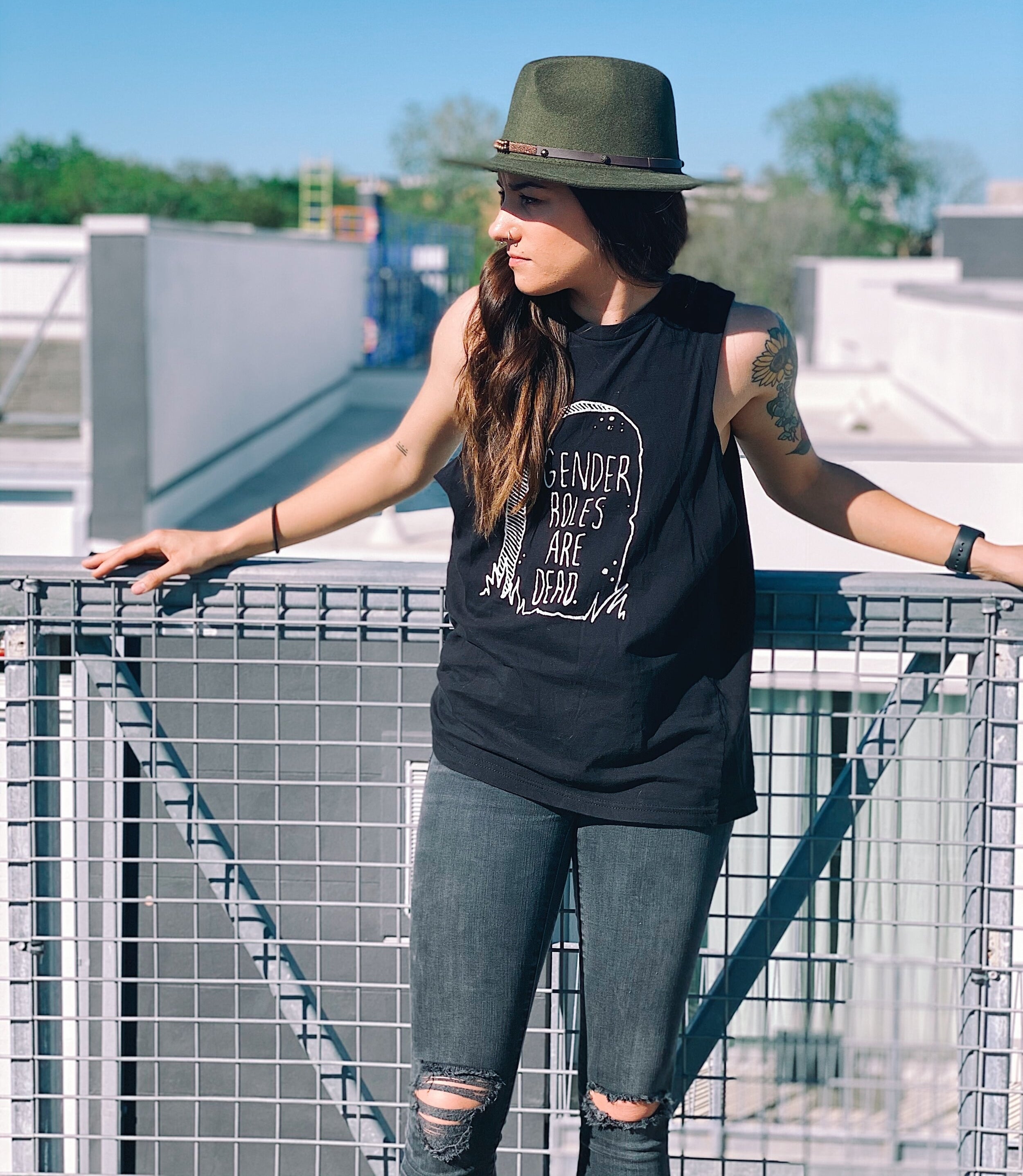 Model wearing the "gender roles are dead" tank top in black