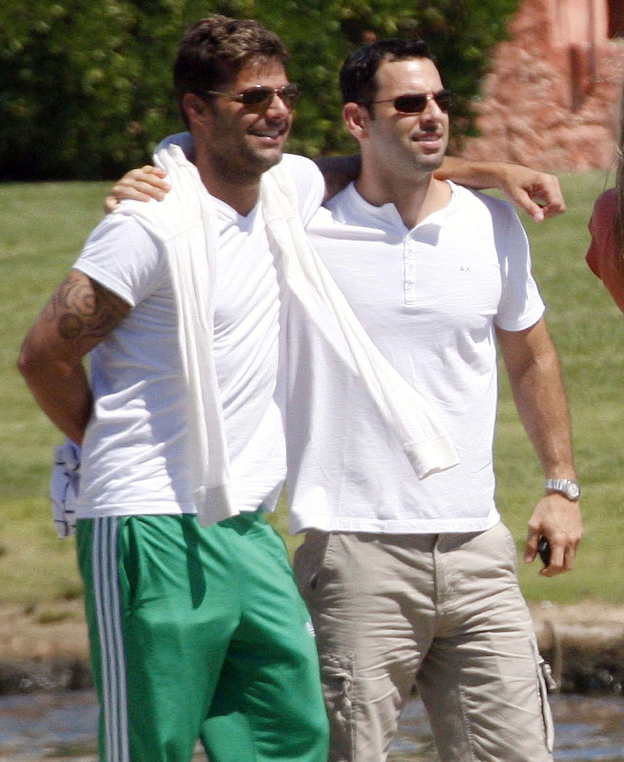 Ricky and Carlos outside embracing