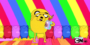 Gif of Jake the Dog from Adventure Time painting a rainbow onto himself in front of a dancing rainbow 