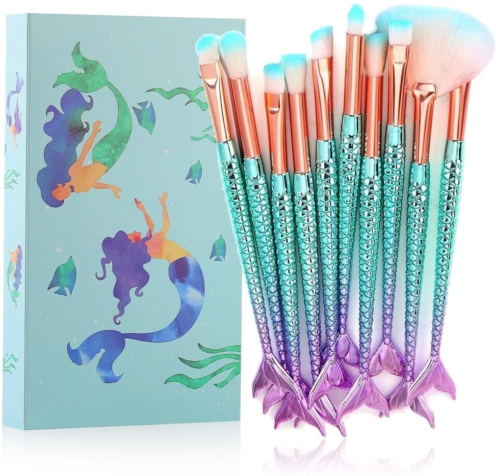 A set of makeup brushes with mermaid tails