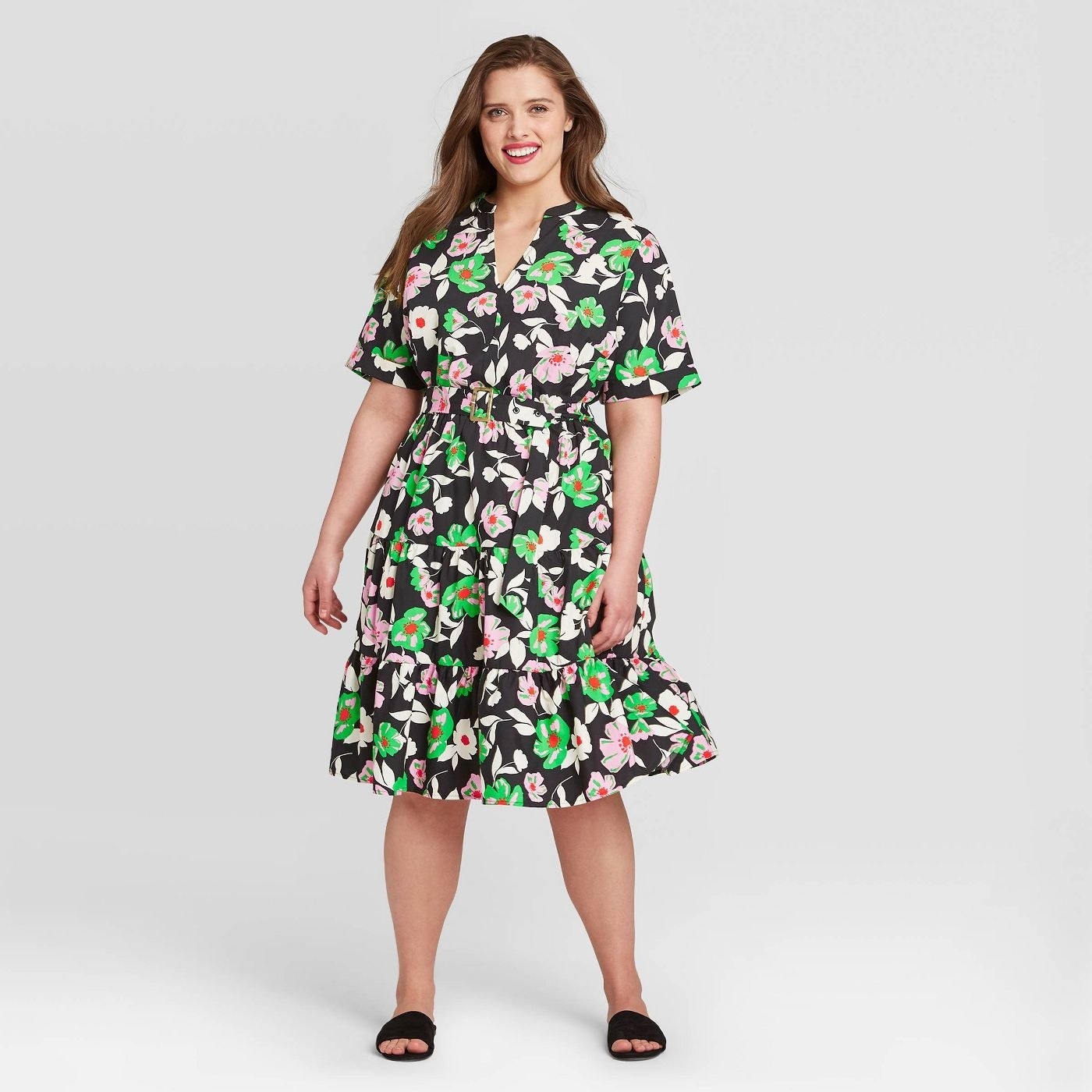 A black short-sleeved dress with pink and green florals 