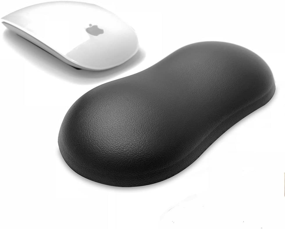 A small round wrist rest sitting next to a wireless computer mouse