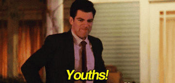 Schmidt from &quot;New Girl&quot; yelling &quot;Youths!&quot; with an angry facial expression.