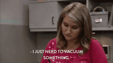 A gif of Jillian Belk from the show Workaholics saying, &quot;I just need to vacuum something.&quot;